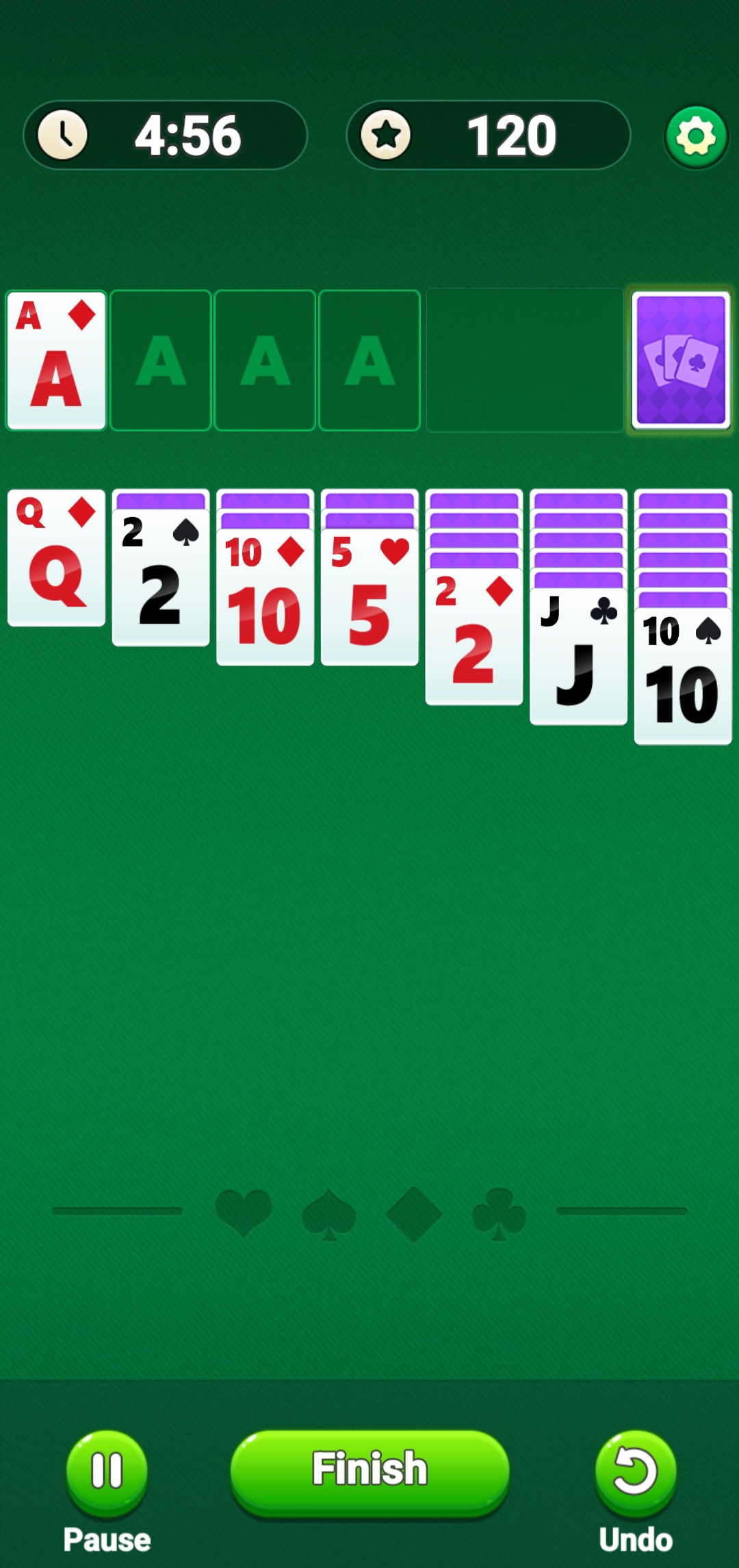 Solitaire Clash Game in progress with cards laid out, timer showing 4:56 and score of 120 at the top.